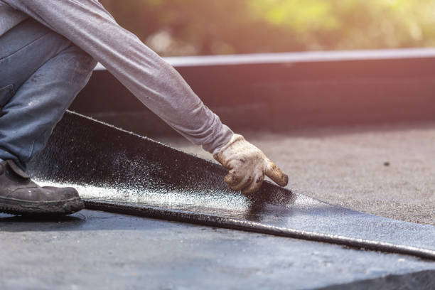 Professional Basement Waterproofing technician working in North Baltimore, OH